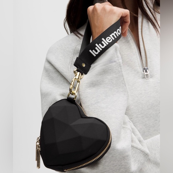 lululemon athletica Handbags - NWT LULULEMON HEART WRISTLET BLACK GOLD